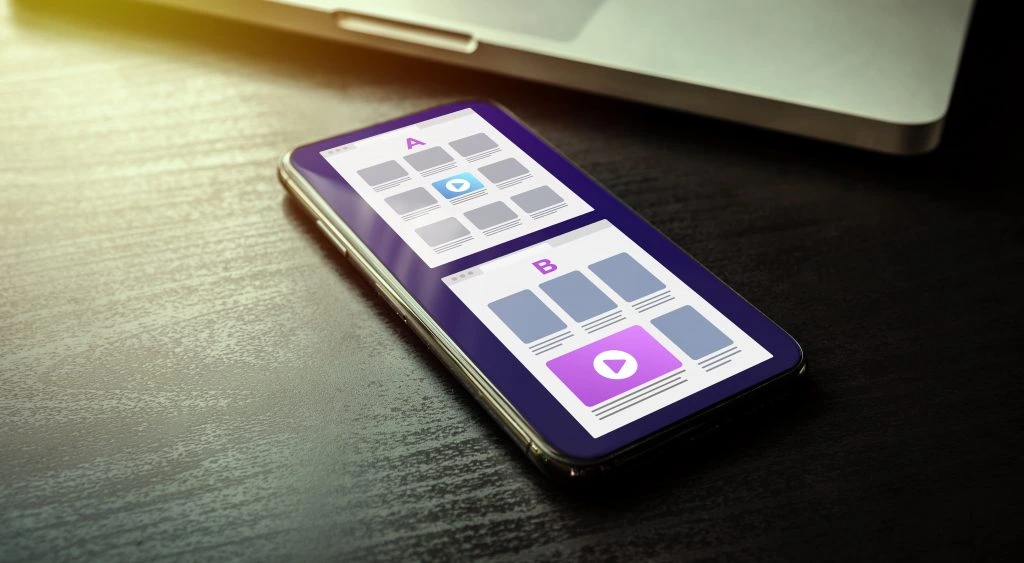 image of a mobile phone with two screenshots illustrating a/b testing
